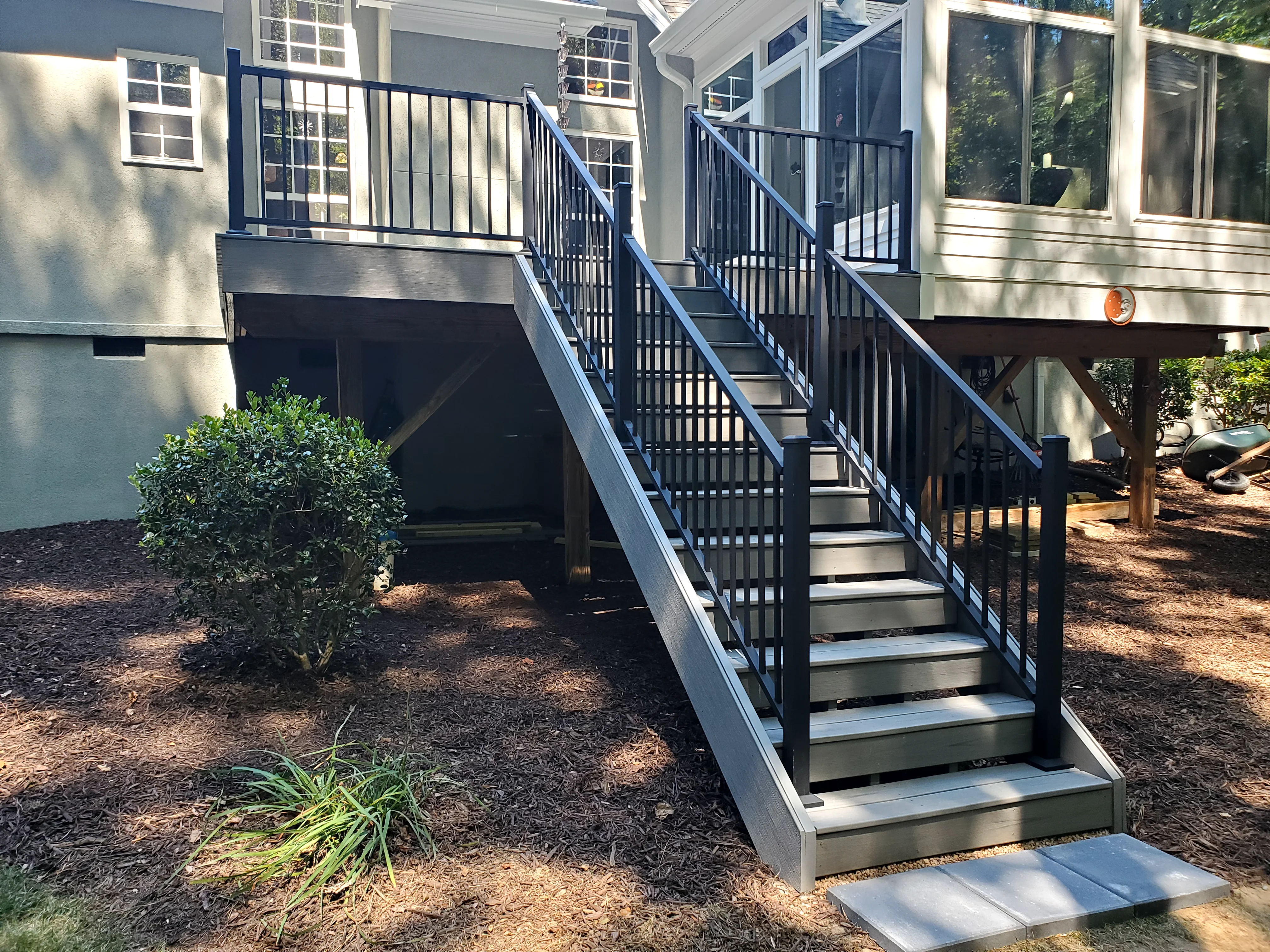 Beautifully stained deck with handrail